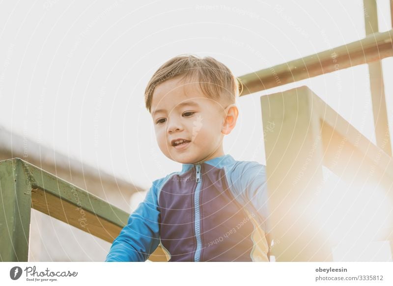 cute young mixed race boy smiling in the sun Lifestyle Happy Leisure and hobbies Playing Sports Child Human being Boy (child) Man Adults Family & Relations