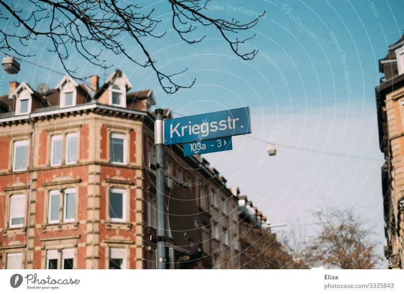 Stupid name House (Residential Structure) War Karlsruhe war road Street sign Blue sky Old building Town Retro Colours Colour photo Exterior shot Deserted