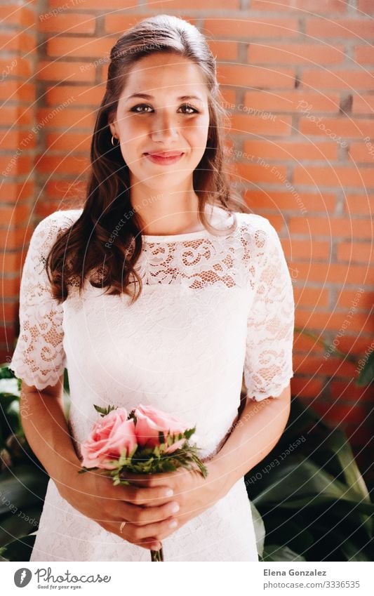 Bride holding her small wedding bouquet of pink roses. Wedding Feminine Woman Adults Plant Rose Bouquet Love Together Pink Romance Colour Idea Arrangement