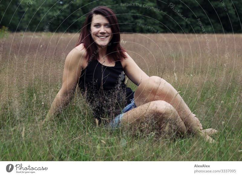 Portrait of a tall smiling young woman on a summer meadow Lifestyle Joy already Harmonious Trip Summer Young woman Youth (Young adults) 18 - 30 years Adults