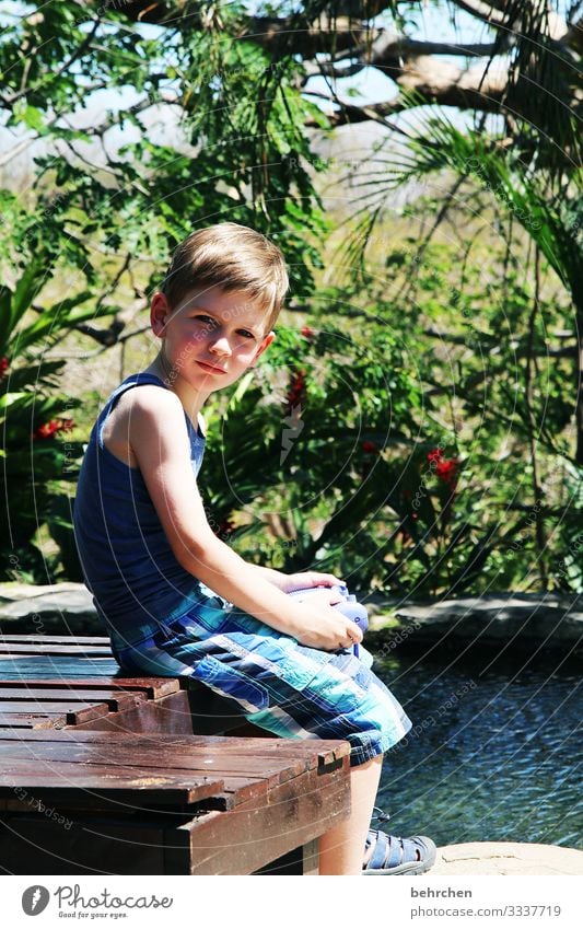 read stories Wanderlust Costa Rica Contentment Boy (child) Child Adventure Vacation & Travel Happy fortunate Infancy Garden pool