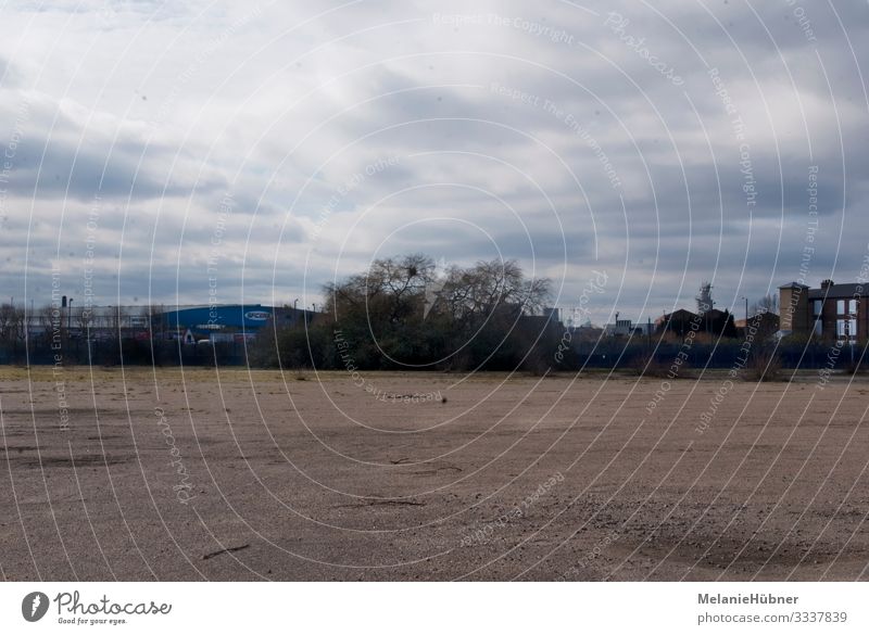 Free field in the urban area of London Meadow Field Capital city Outskirts Overpopulated Deserted Places Gloomy Town Greenwich Great Britain Clouds Sky