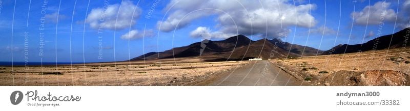 Gravel road into the mountains Mountain Clouds Panorama (View) Loneliness Large Panorama (Format)