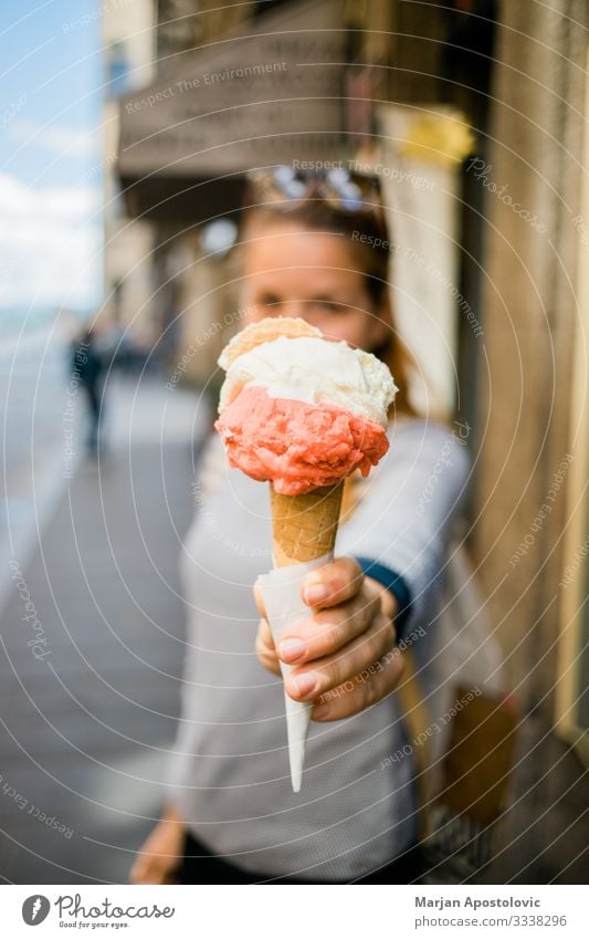 Young woman holding delicious ice cream in the street Dessert Ice cream Fast food Lifestyle Vacation & Travel Tourism Human being Feminine Youth (Young adults)