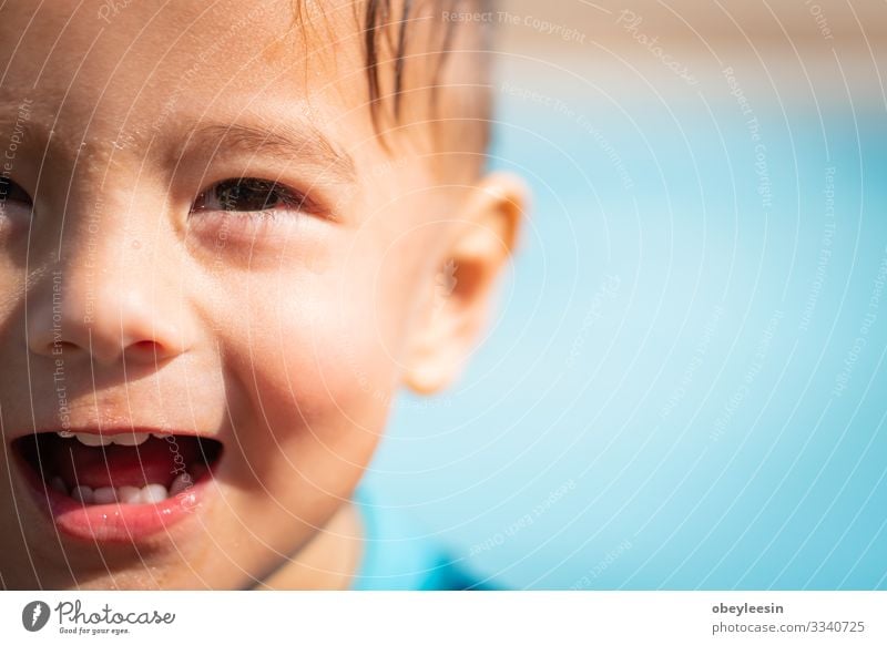 cute young mixed race boy smiling in the sun Joy Happy Face Relaxation Swimming pool Leisure and hobbies Playing Vacation & Travel Summer Sports Success Child