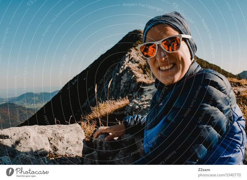 On the summit of the Brecherspitz | Bavaria crusher tip Hiking mountain Alps Peak panorama Going Athletic Sports shrubby warm Autumn Green Brown Woman Blue sky