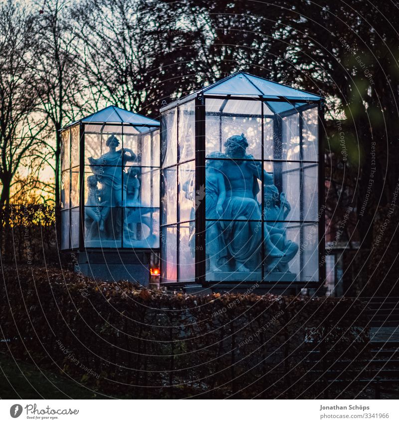 Stone statues in glass cage at night Evening sun Chemnitz Germany Twilight Saxony Woman Statue Sculpture Stone sculpture Creepy Hallowe'en Pane Night