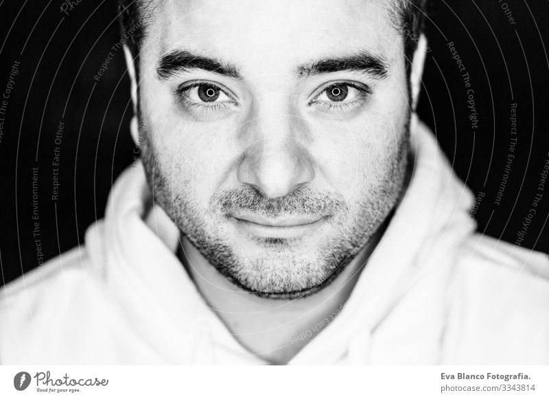 close up half side portrait of a young man. studio shot. led ring reflection in the eyes Head White Human being Man Black Dramatic Lifestyle Close-up 1