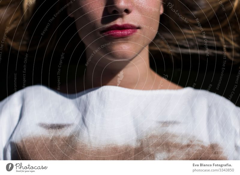 close-up Half face beautiful young woman. Red lips. lying on the floor. Lifestyle Woman Youth (Young adults) Lipstick Alluring Style Girl Skin To enjoy