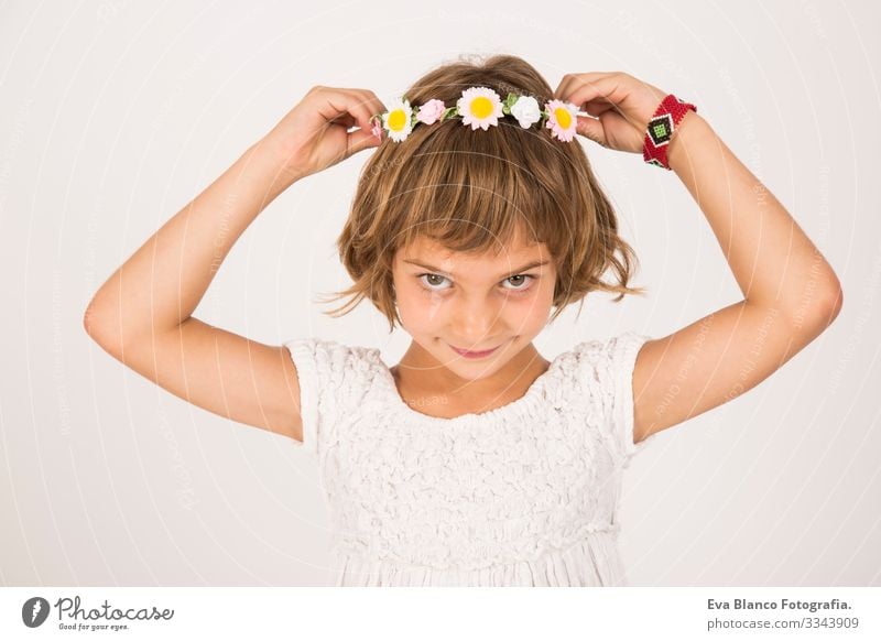 Close up indoors portrait. Beautiful kid smiling, white background Portrait photograph Joy Child Cute lifestyle happiness Cheerful Small Hair Interior shot Face