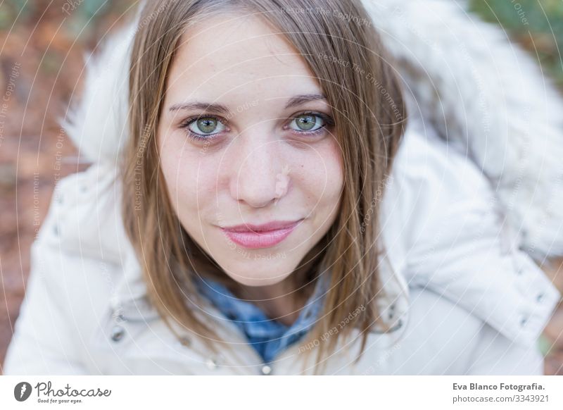 outdoors portrait of a beautiful young woman looking at the camera. Woman posing in autumn. sunset Youth (Young adults) Happy Beautiful Portrait photograph Girl