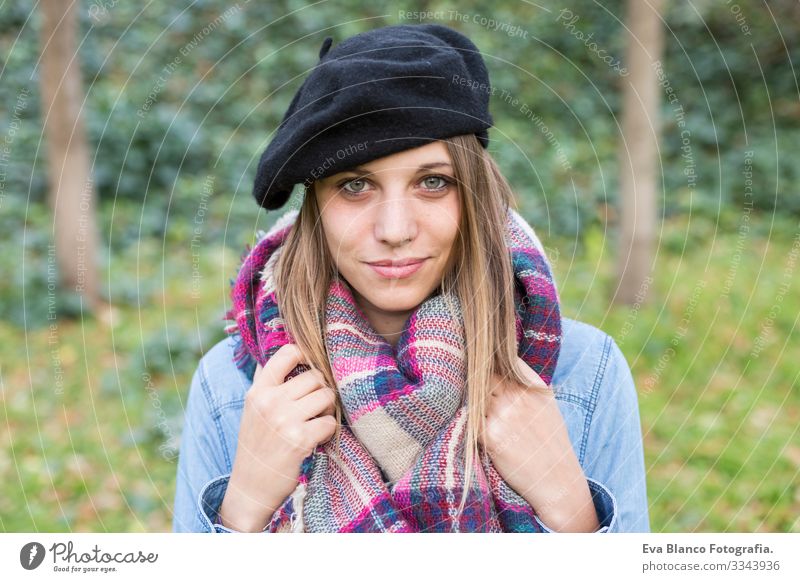 outdoors portrait of a beautiful young woman looking at the camera and smiling. Woman posing in autumn. sunset Youth (Young adults) Happy Beautiful