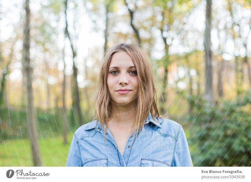 outdoors portrait of a beautiful young woman looking at the camera and smiling. Woman posing in autumn. sunset Youth (Young adults) Happy Beautiful