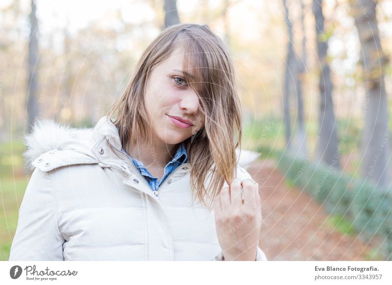 outdoors portrait of a beautiful young woman looking at the camera and smiling. Woman posing in autumn. sunset Youth (Young adults) Happy Beautiful