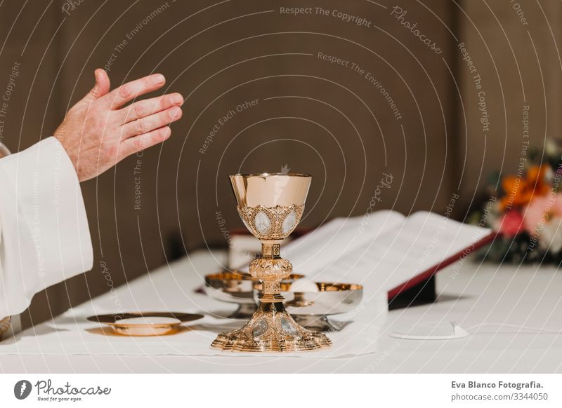 unrecognizable Priest holding the goblet during a wedding ceremony nuptial mass. Religion concept jesus Ritual Protestant Modern divine Cup eucharist Goblet