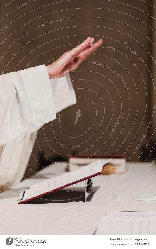 unrecognizable Priest holding the goblet during a wedding ceremony nuptial mass. Religion concept jesus Ritual Protestant Modern divine Cup eucharist Goblet