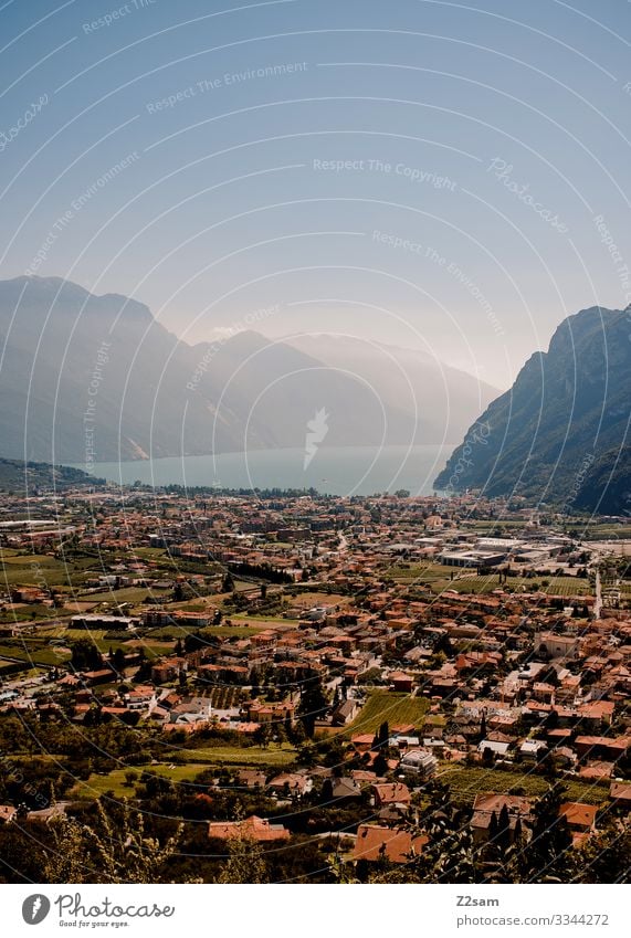 Garda + Lake Garda alpine crossing Mountain bike mtb transalp Town Village panorama Vantage point Blue sky Beautiful weather Summer Sun Haze mountains