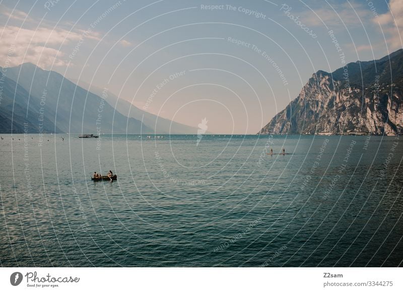 Colourful hustle and bustle on Lake Garda bathe Water mountain lake Mountain Colour photo Italy Summer Vacation & Travel Nature Landscape Lakeside SEA boat