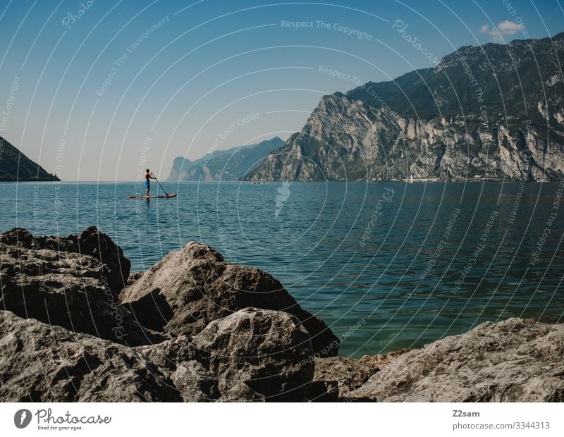 SUP on Lake Garda | Torbole Lakeside Water Aquatics bank stones Rock Nature Blue Mountain Exterior shot Colour photo Landscape Italy Summer Vacation & Travel