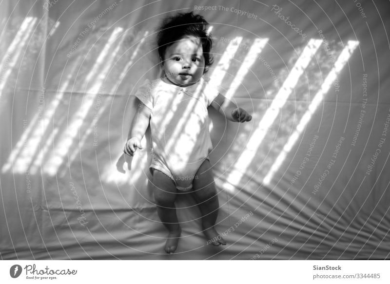 Baby girl in the bed Happy Beautiful Face Child Human being Infancy Smiling Laughter Happiness Small Cute Soft Blue White Delightful Caucasian background kid