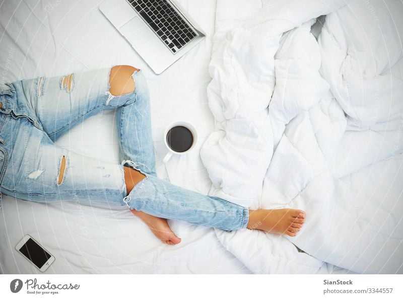 Young woman drinking coffee at home in her bed top view Coffee Beautiful Life Relaxation Reading Bedroom Work and employment Workplace Telephone PDA Computer