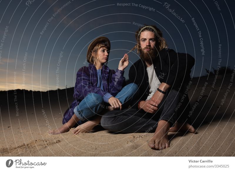 A young couple outdoors enjoying a sunset in the beach Lifestyle Elegant Style Beautiful Human being Masculine Young woman Youth (Young adults) Young man Woman