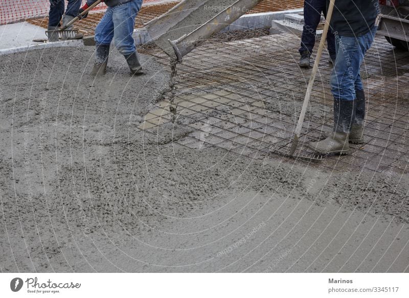 workers pouring wet concrete using concrete bucket. Work and employment Construction site Industry Business Building Street Concrete Steel Wet cement mix