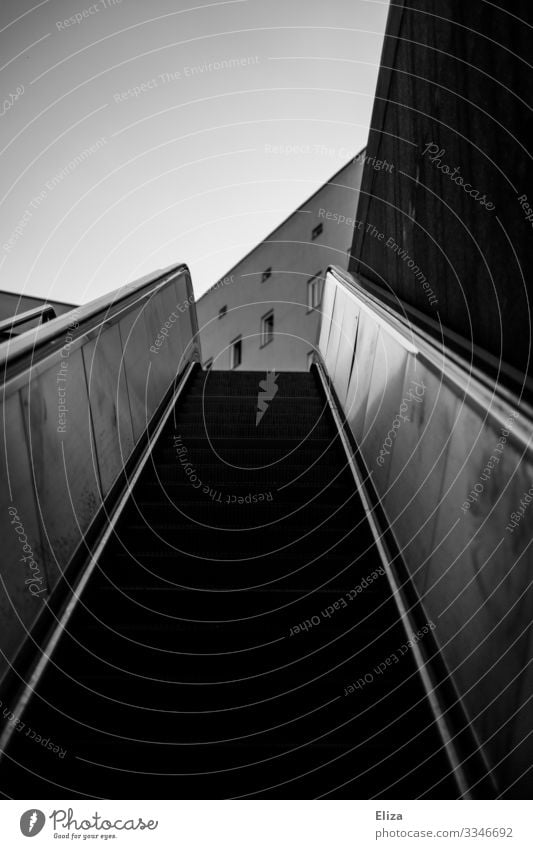 upward Escalator Planning Target Upward Subway station Stairs Lanes & trails Career Dark Canyon Middle Threat Go up Tall Future Steep End Black & white photo