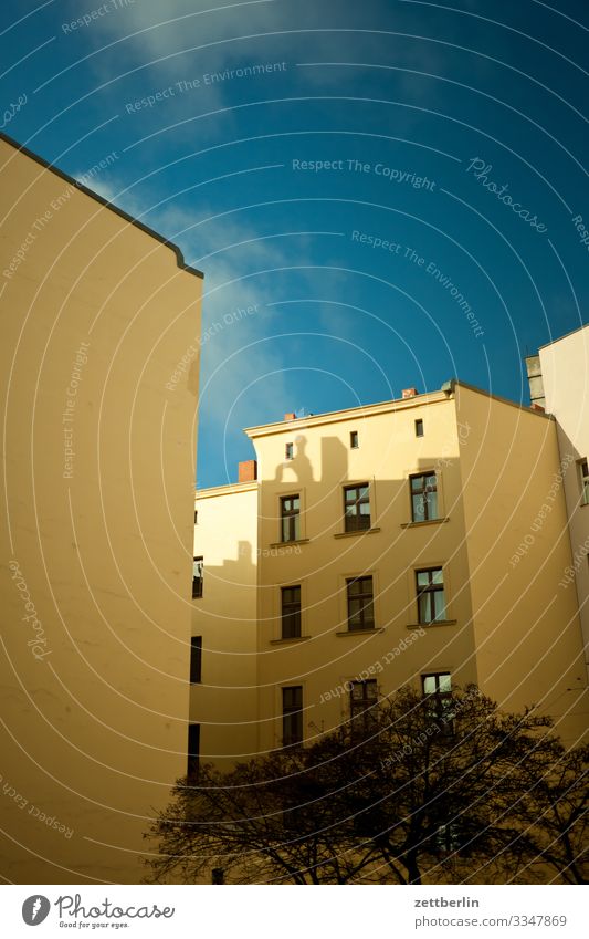 Backyard in Schöneberg Old building Fire wall Facade Window House (Residential Structure) Sky Heaven Blue sky Behind Courtyard Interior courtyard Downtown