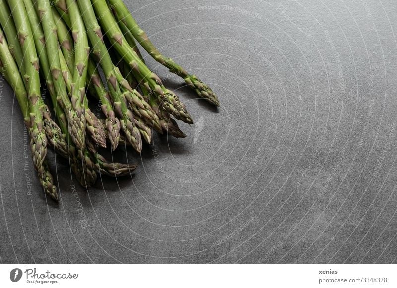 fresh green asparagus on grey worktop Asparagus Food Vegetable Asparagus season Nutrition Organic produce Vegetarian diet vegetable asparagus Stone Fresh