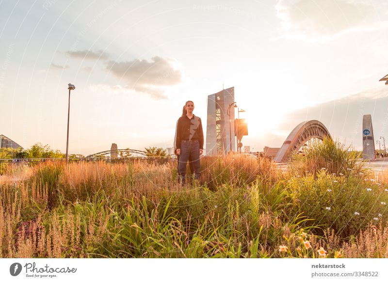 Young Woman Standing in Tall Grass Success Adults Youth (Young adults) Bridge Contentment dancing back to back girls dancers real life real people two women