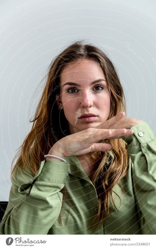 Portrait of a Young Woman Looking Towards the Camera 2 Beautiful Face Adults Youth (Young adults) Hand Youth culture White girl wall Caucasian