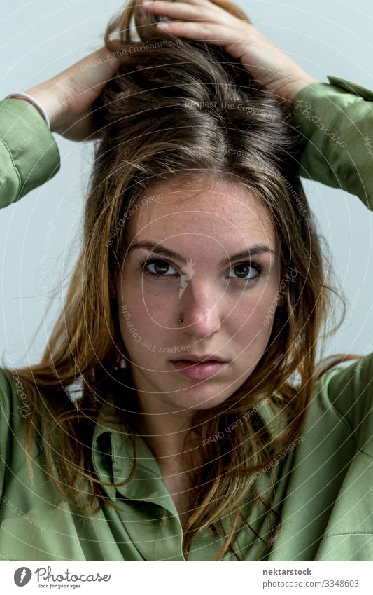 Close up of a Young Woman With Hands on Hair Beautiful Face Adults Youth (Young adults) Youth culture White girl hair wall Caucasian Nationalities and ethnicity