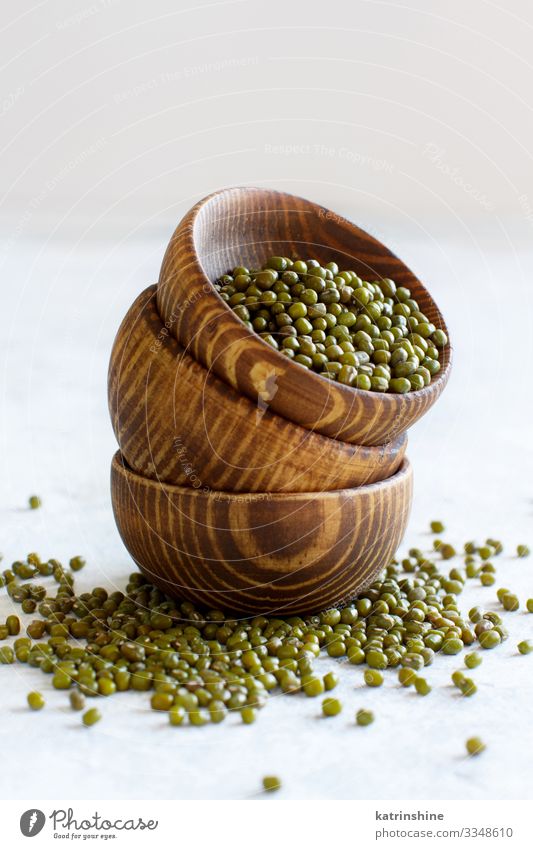 Dried mung beans in wooden bowls Vegetarian diet Diet Bowl Table Wood Green White Beans fiber food health healthy Ingredients Kidney legume Vegan diet Raw