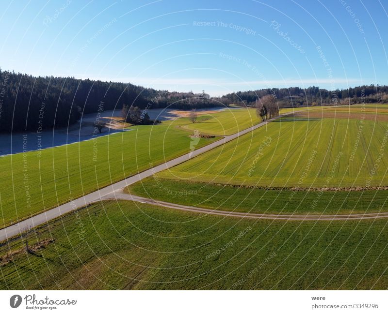 Aerial view of a dirt road between fields Field Traffic infrastructure Street Road junction Free Fresh Green area flight bird's eye view copter country