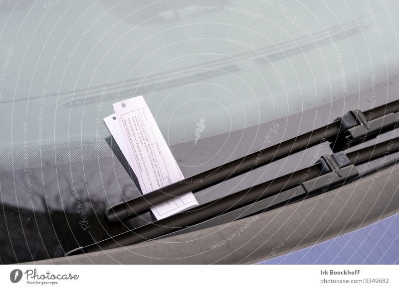 Wrong parking and receiving parking tickets Downtown Transport Road traffic Motoring Car Piece of paper Parking ticket Signage Warning sign Ignorant Aggravation