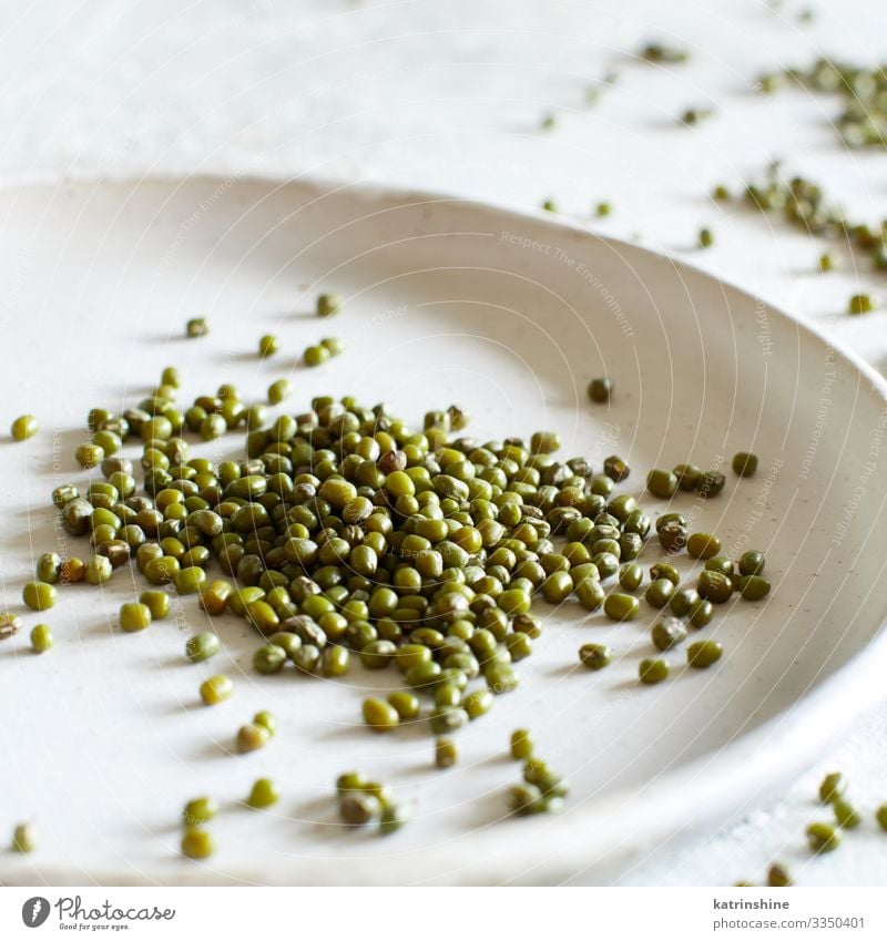 Dried mung beans on a ceramic plate Vegetarian diet Diet Plate Table Green White Beans marble fiber food health healthy Ingredients Kidney legume Vegan diet Raw