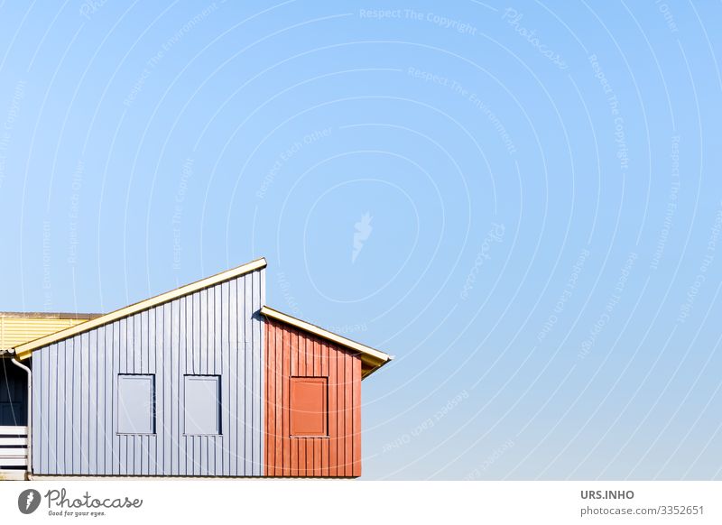 Wooden house with a two-stage monopitch roof against a blue background and plenty of text space Sky House (Residential Structure) built Facade Window Roof Eaves