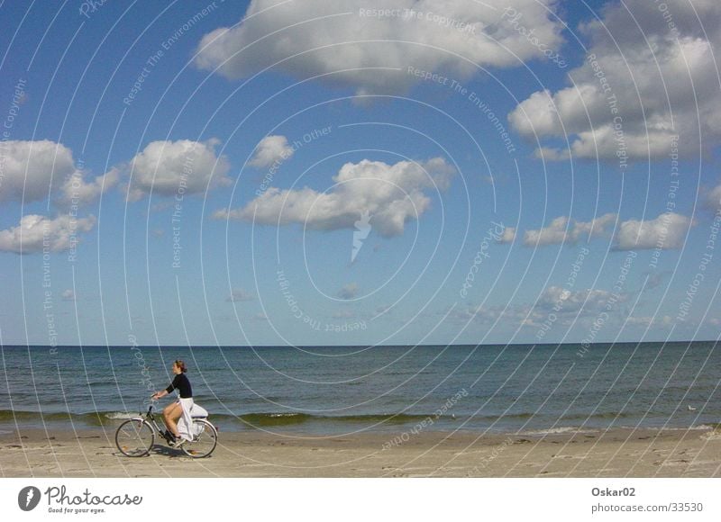 Bicycle on the beach Woman Beach Ocean Clouds