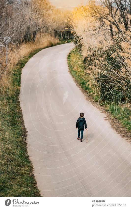 Lonely kid walking on a road. Aerial view Lifestyle Joy Vacation & Travel Adventure Summer Mountain Hiking Child Human being Masculine Toddler Boy (child)