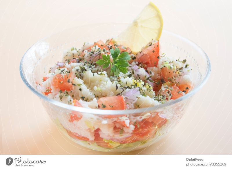 Traditional oriental salad Tabbouleh in bowl Diet Bowl Tabbouli Arabia arabic brown background cilantro couscous cucumber iraqi Israeli Lebanese Lemon oil Onion