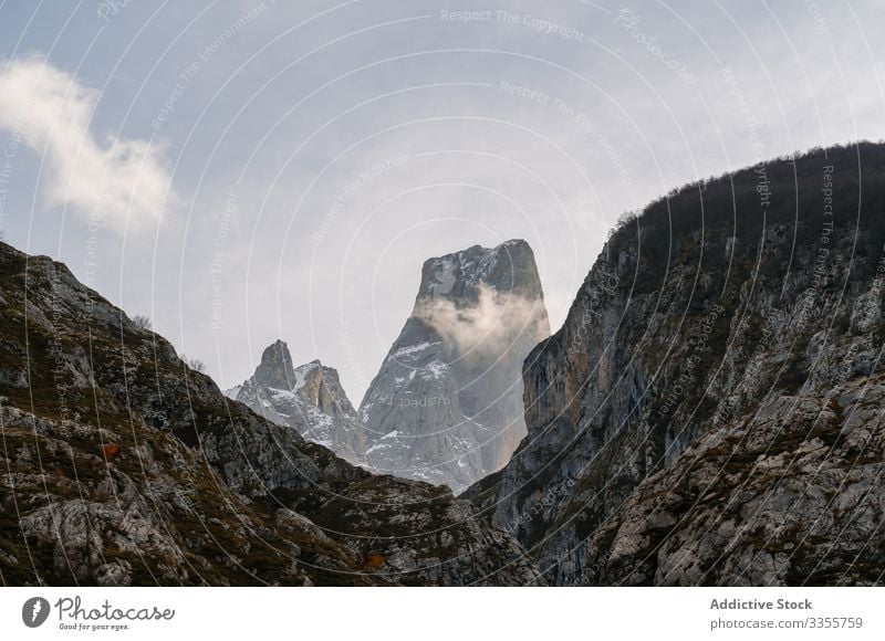 Valley in peaks under gray cloudy sky mountain rock valley rocky nature europe landscape scenic scenery park asturias spain natural serene stone season journey