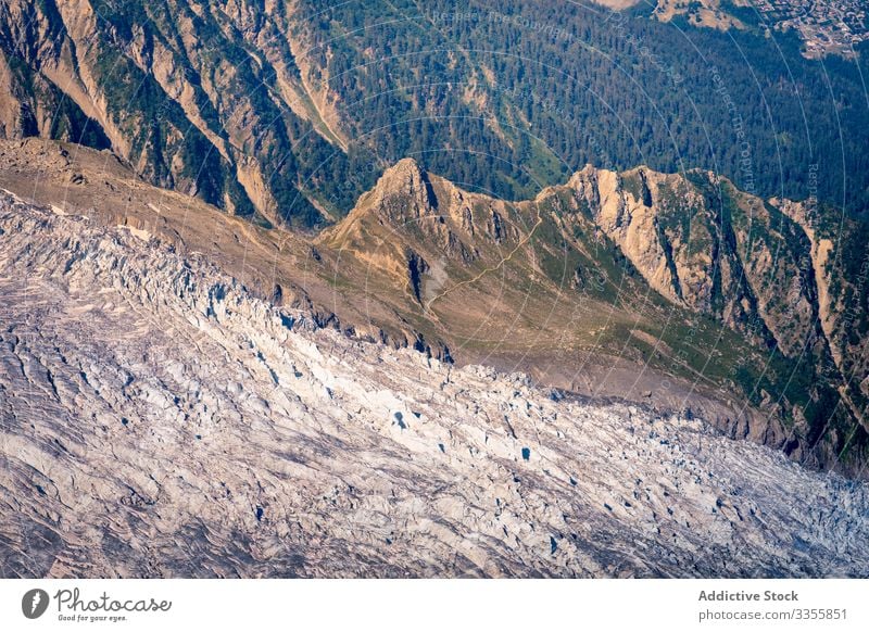 White sharp mountain peaks in snow raising up to cloudy sky rock hiking scenery snowy rocky nature landscape scenic natural tourist mont-blanc extreme chamonix