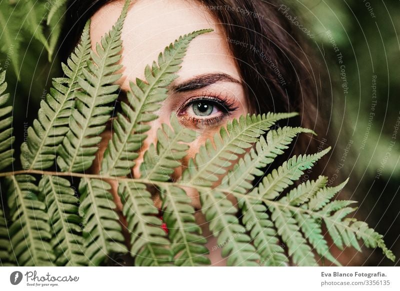 close up portrait of a young beautiful woman among green fern leaves Clean Youth (Young adults) Attractive Adults Skin care front Face Fresh Portrait photograph