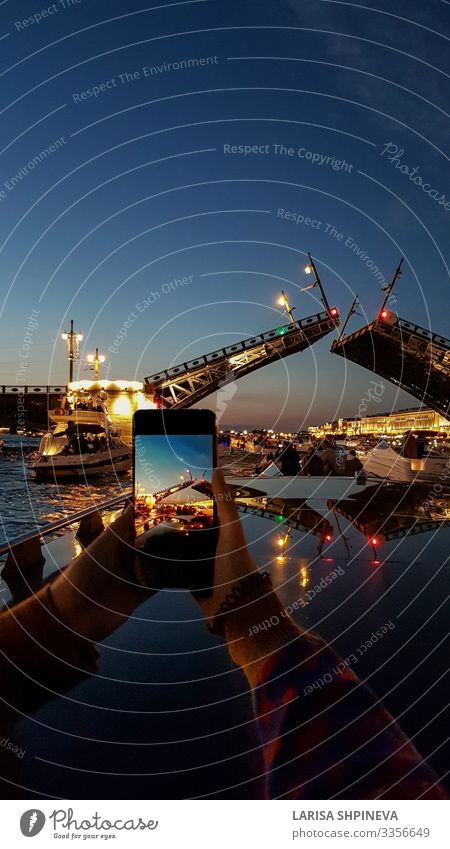 Girl takes photo breeding Bridge in White Nights Boating trip Relaxation Emotions Joy Petersburg Russia Tourism Neva River Young woman Architecture City Water