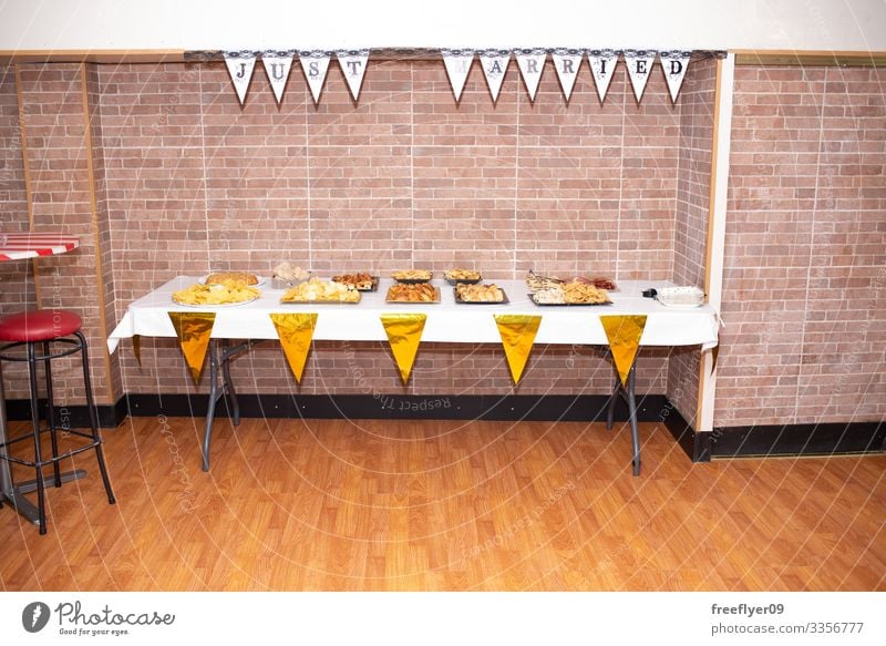 Table full of food at a wedding party lunch white counter table buffet holiday appetizer decoration line service anniversary banquet dining eat dish desert