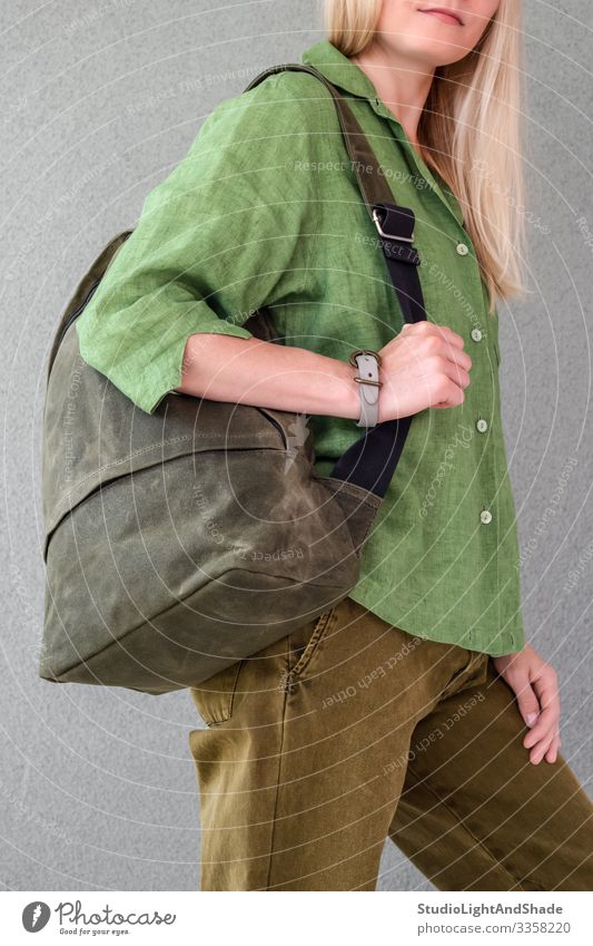 Woman in green clothes holding backpack Beautiful Summer Human being Young woman Youth (Young adults) Adults Fashion Clothing Shirt Pants Jeans Blonde