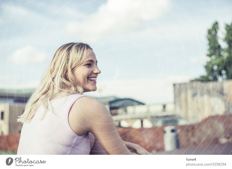 laughing young woman Woman relaxed To enjoy fortunate cheerful deceleration fun sunbathe youthful Young woman left Joy Relaxation time-out Laughter Smiling