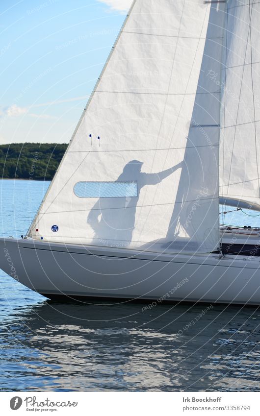 Shadow play on a sailing boat Leisure and hobbies Sailing Summer Summer vacation Sun Ocean Aquatics 1 Human being North Sea Baltic Sea Sport boats Yacht