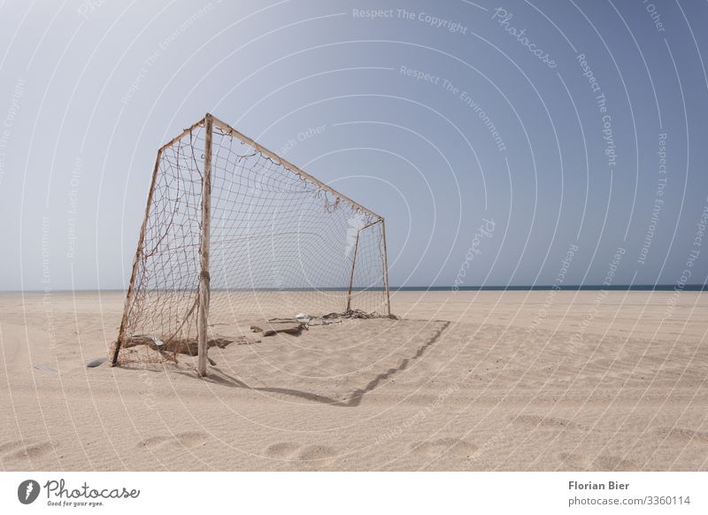 Football goal on the beach Ball sports Hooligan Soccer Goal Sky Climate change Warmth Drought Beach Desert Footprint Net Old Athletic Dirty Sharp-edged Broken